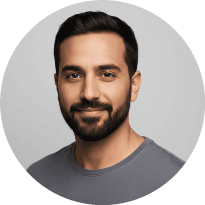 A close-up headshot of a friendly, bearded man smiling gently against a clean studio background, used as a trustworthy user review avatar for an online social community